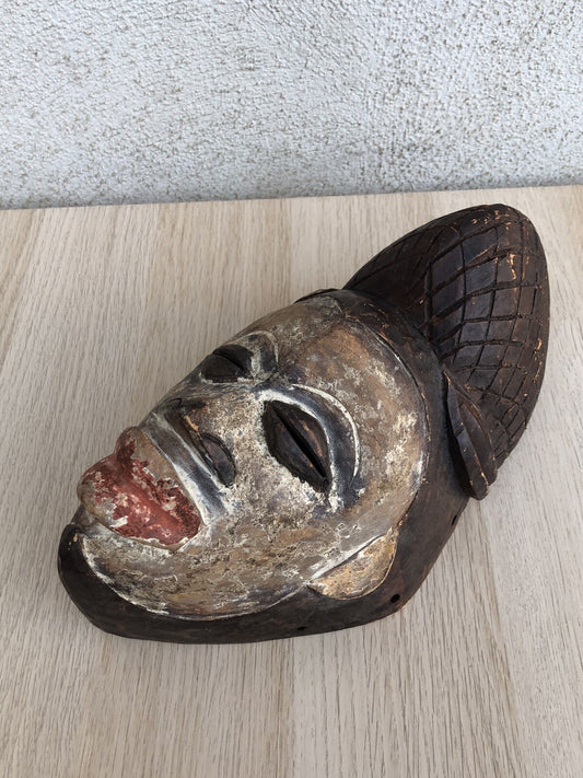 Maschera africana in legno intagliata a mano vintage